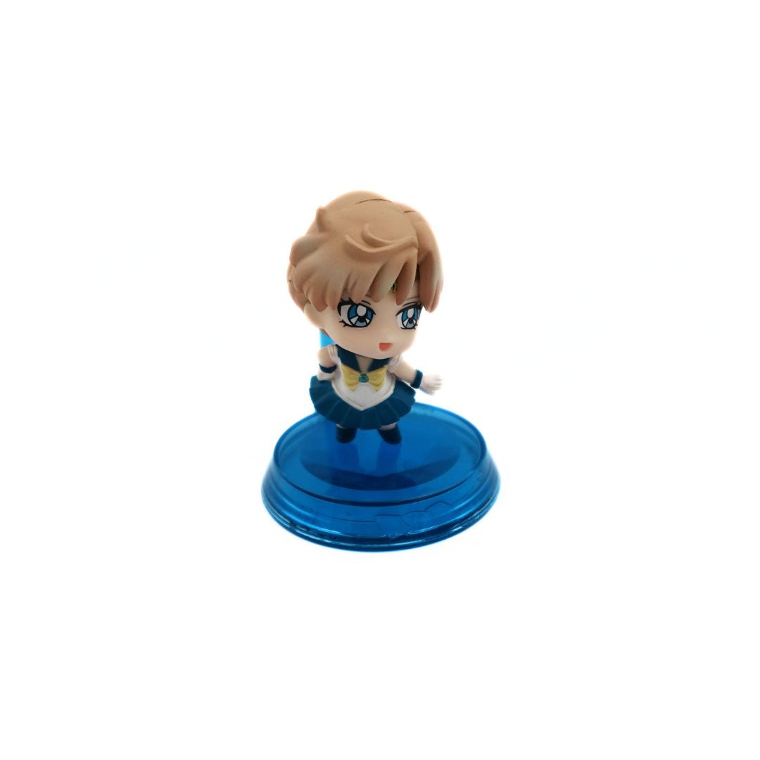 A petite Gacha Sailor Uranus Mini Figure in a blue costume on a blue stand