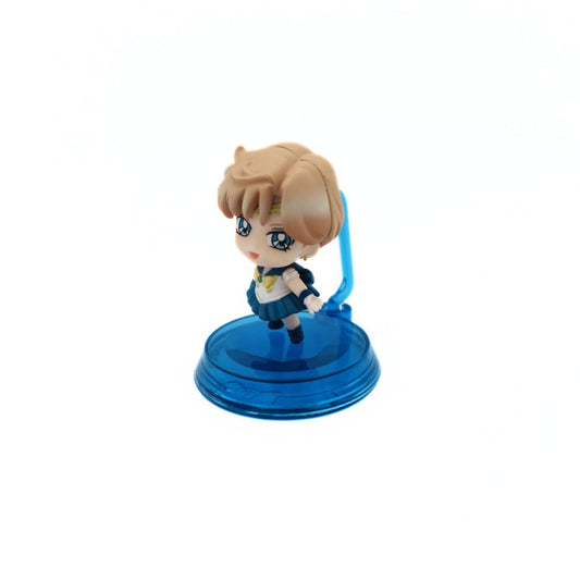 A petite Gacha Sailor Uranus Mini Figure in a blue costume on a blue stand