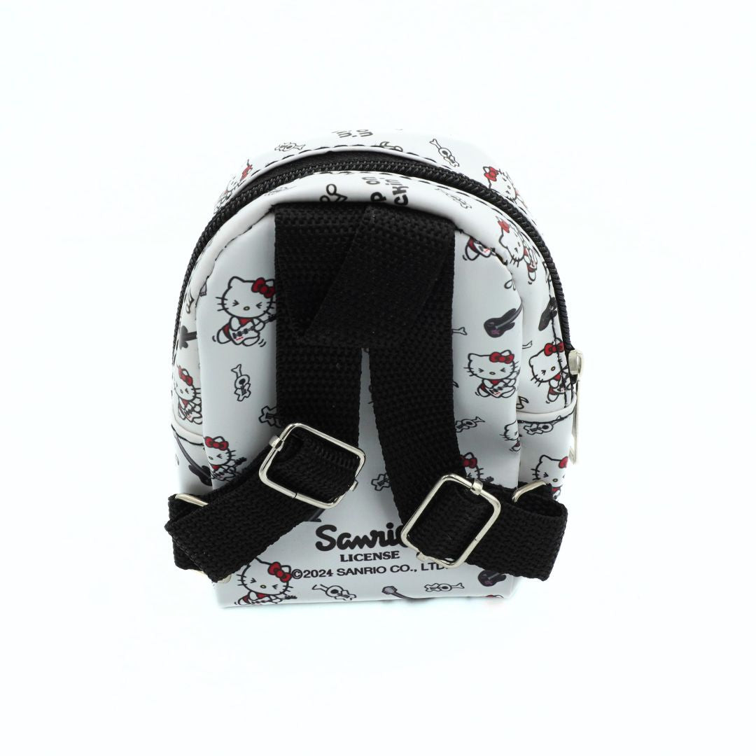 A small white backpack featuring a black and red Hello Kitty cartoon print, with adjustable black webbing straps and silver metal buckles. The brand 'Sanrio' is printed on the front.