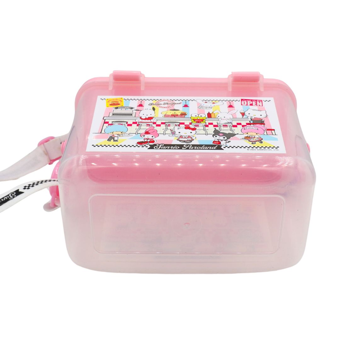 A pink translucent plastic lunch box with a cartoon character label on top, shown on a plain white background.