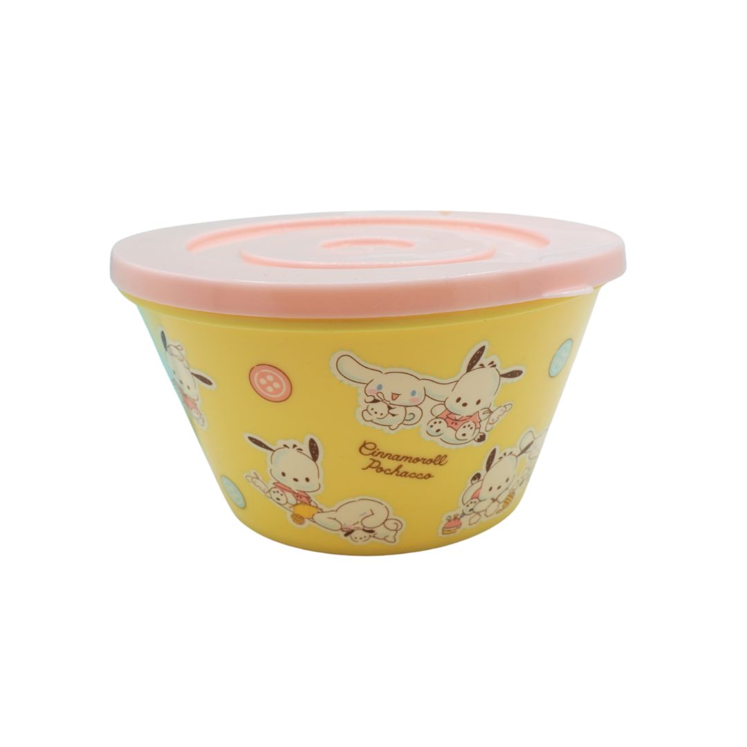 A yellow plastic storage container with a light pink lid, decorated with cute Sanrio character illustrations including Cinnamoroll and the 'Cinnamoroll Palace' text.