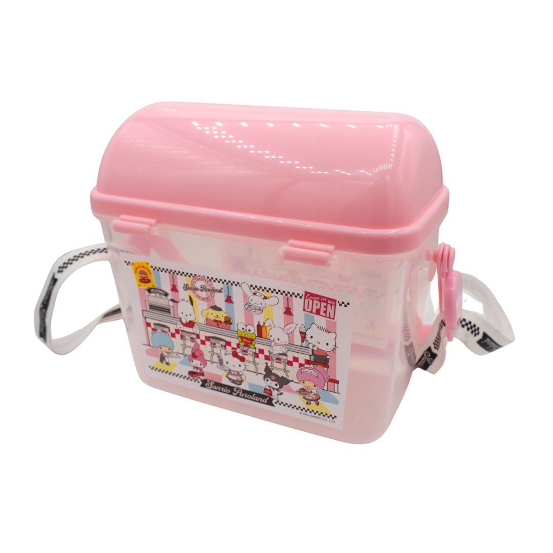 A pink plastic storage container with a hinged lid, carrying handles on both sides, and a colorful Hello Kitty themed label on the front, set against a plain white background.