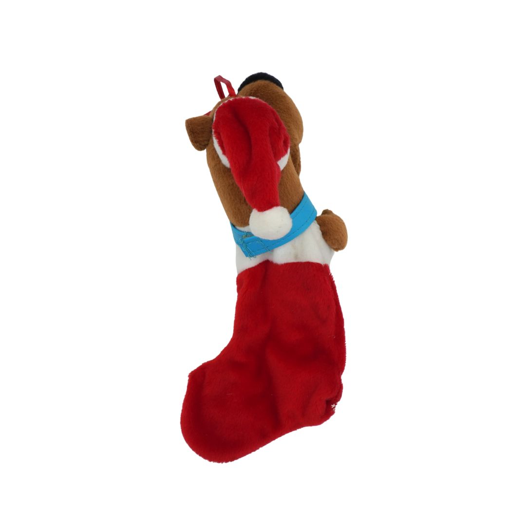 Plush dog toy with a Santa hat on a white background
