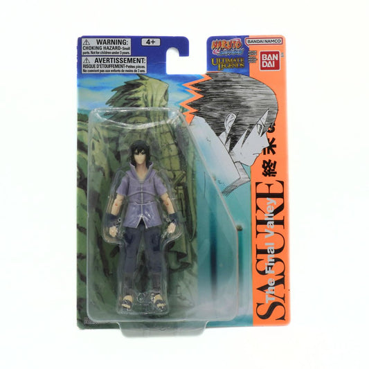 Action figure in packaging with 'Sasuke' branding on a white background