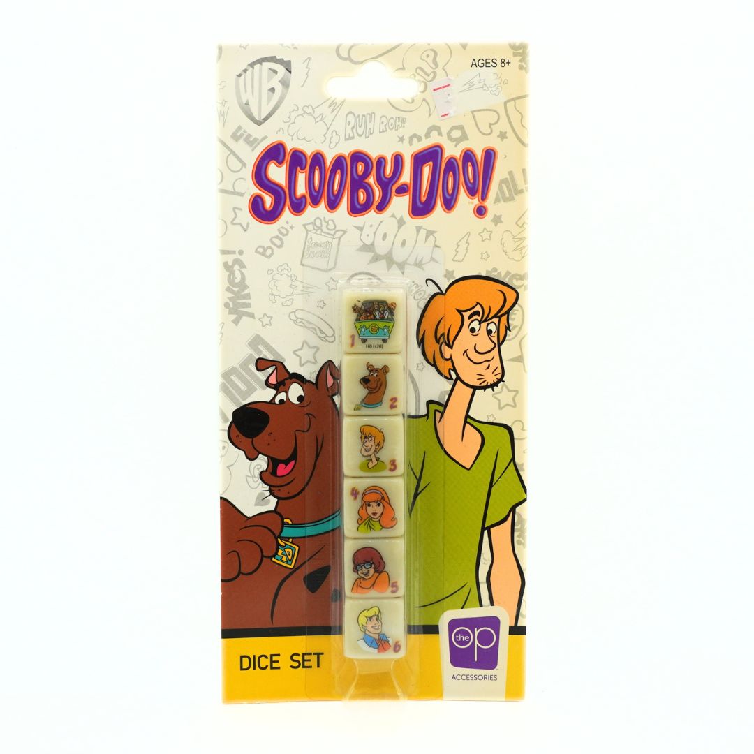 Scooby-Doo! dice set in its original packaging, featuring cartoon illustrations of Scooby and Shaggy on a cream-colored card with purple branding.