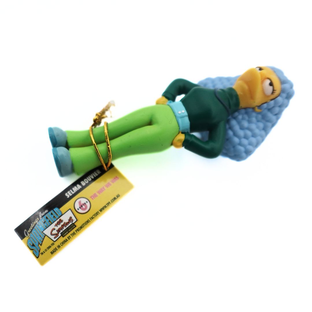 A Series 6 tag attached to a 2006 Selma Bouvier character from The Simpsons
