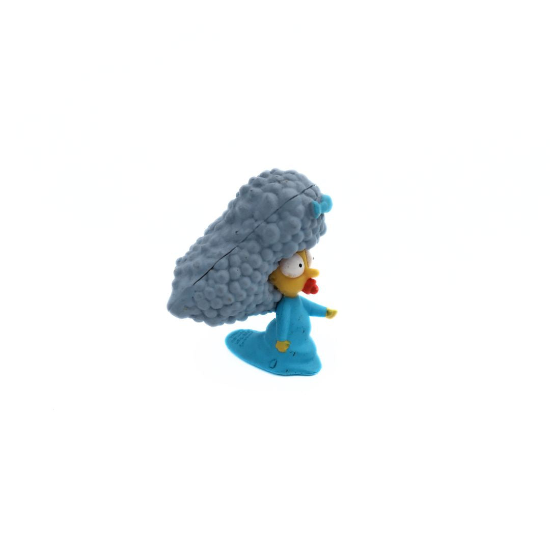 A 20th anniversary Simpsons Selma Patty Maggie figurine with a blue dress and bow