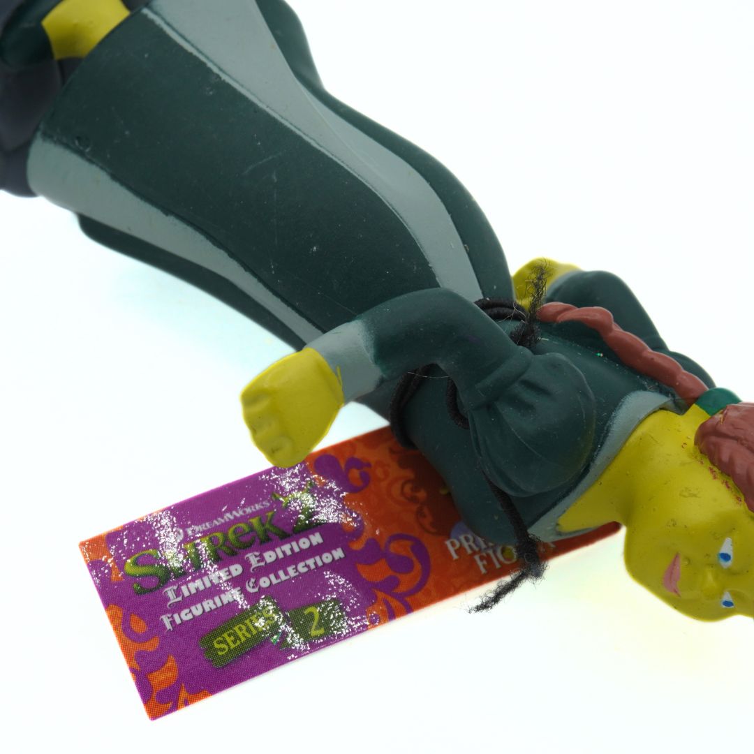 Toy figure with a purple packaging label on a white background