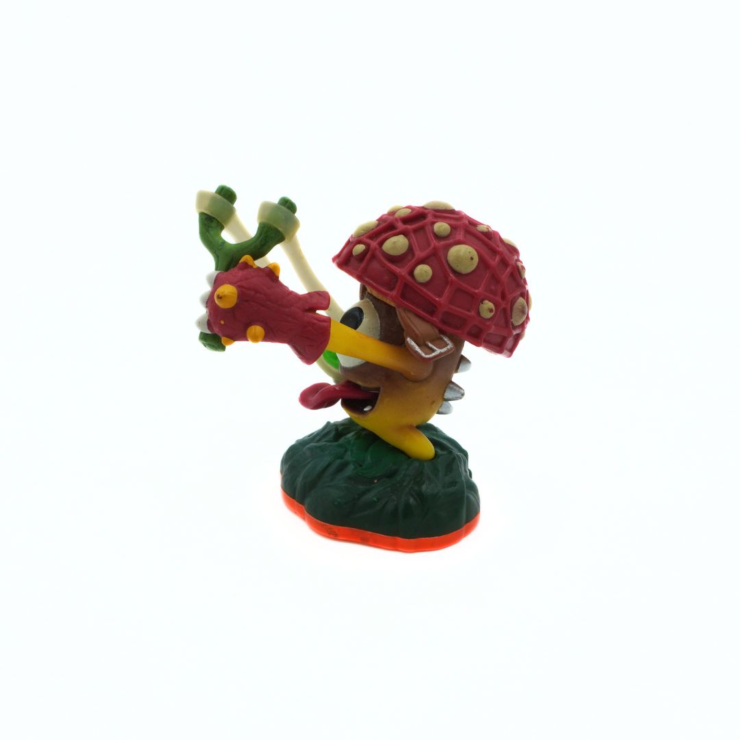 Colorful toy figure of a character with a red shell and green plant on a white background