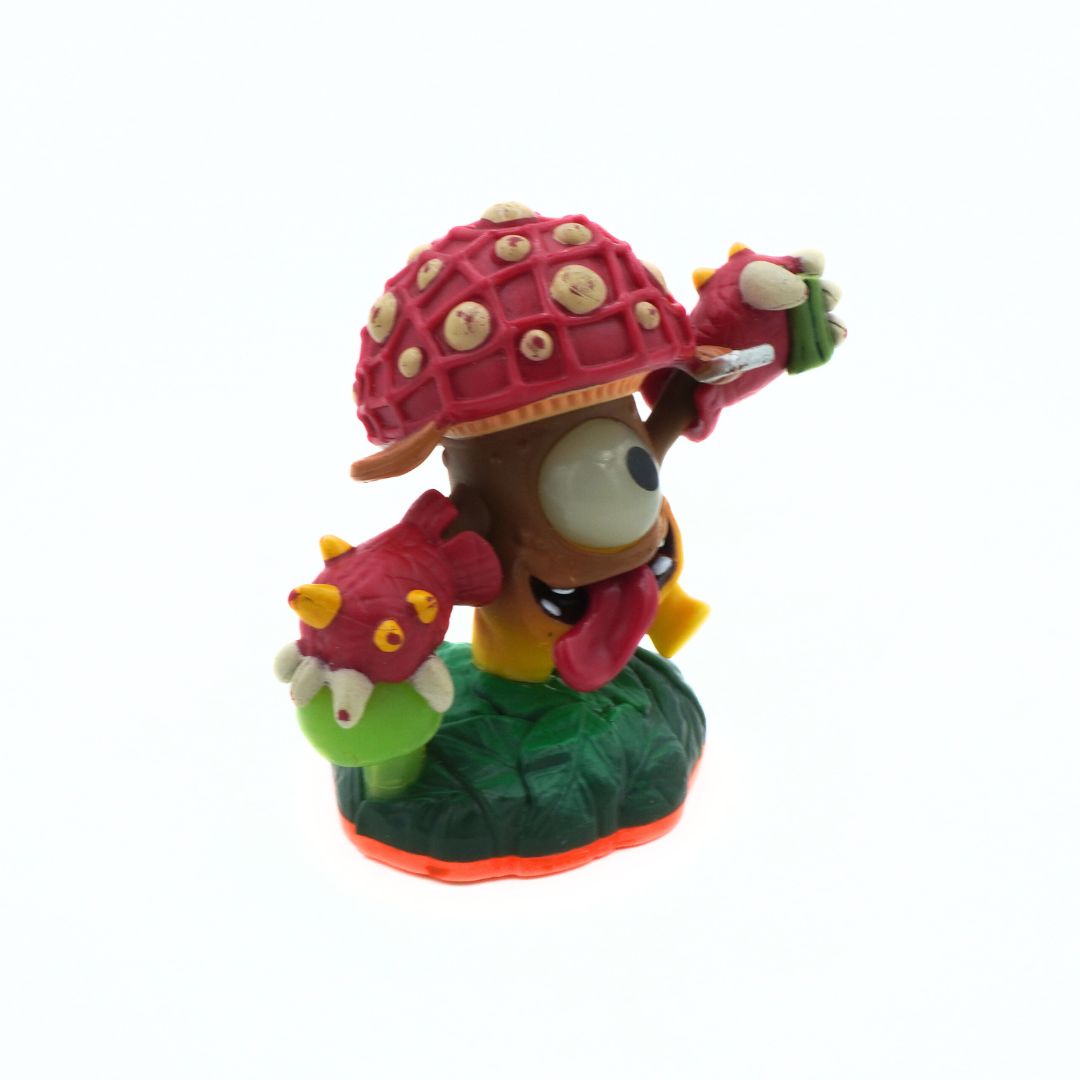 Colorful toy figure of a character with a red shell on a white background