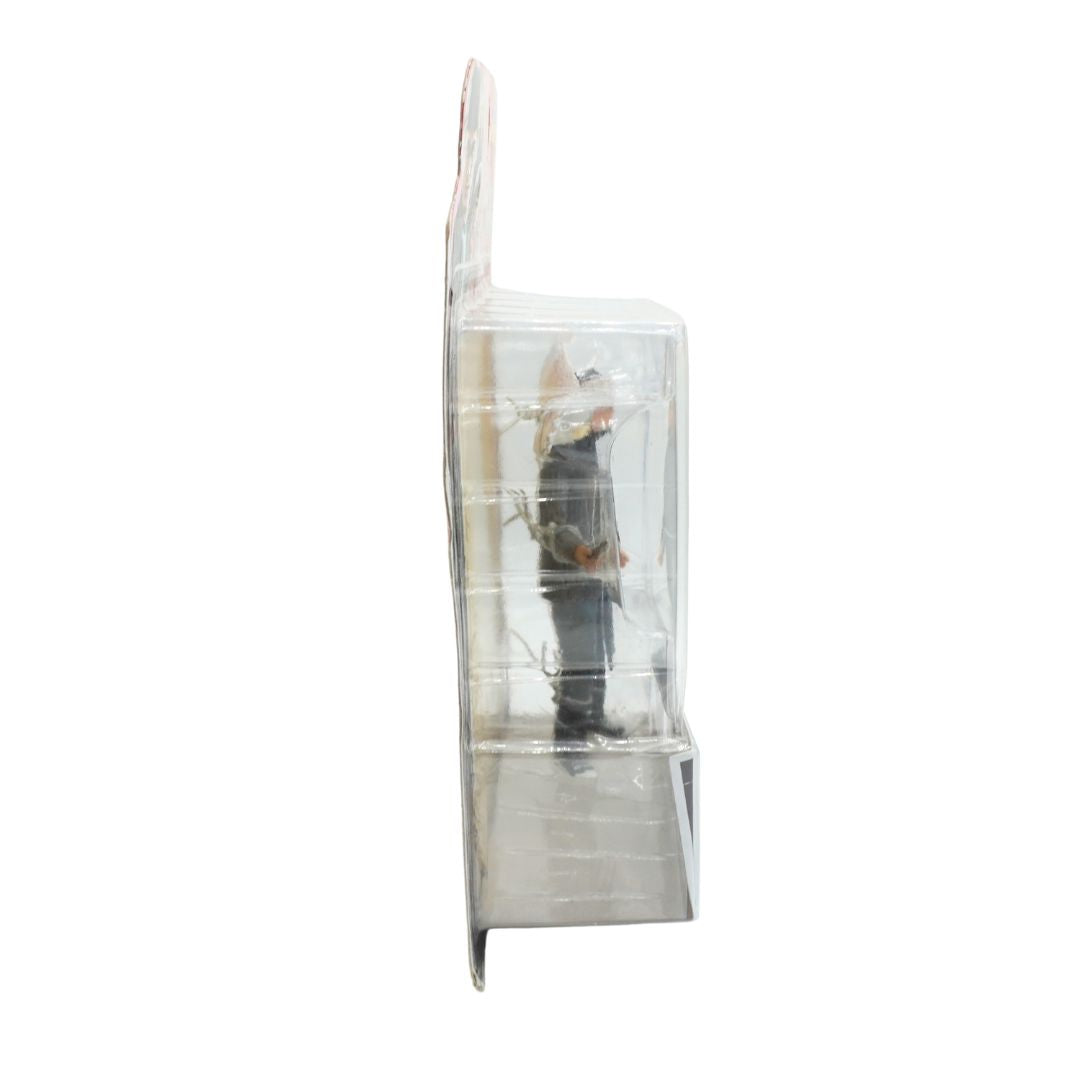 Clear plastic packaging with a figurine inside on a white background