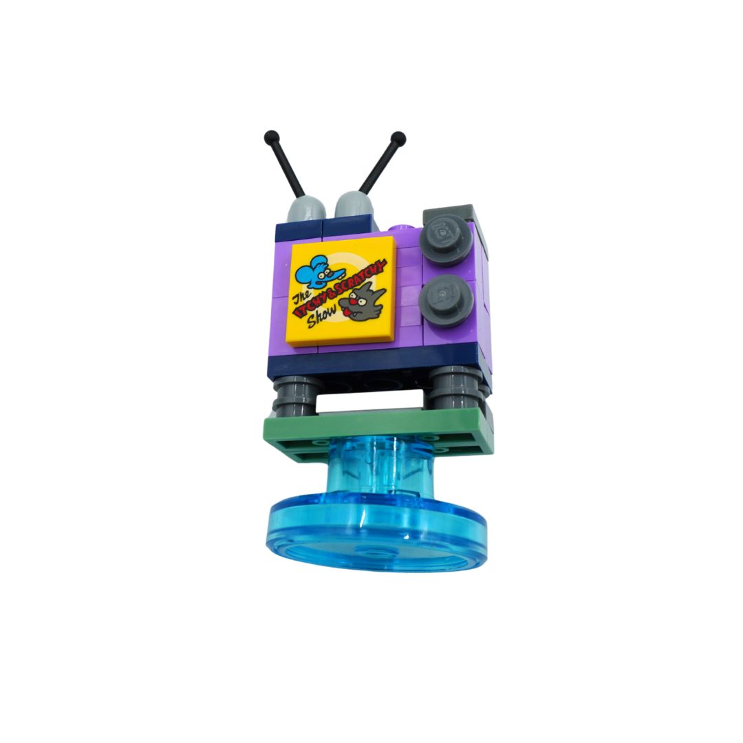 A small toy building-block structure resembling a retro television or character figure, with a purple upper box, yellow front panel, black antennas, green base, and a translucent blue circular bottom piece, shown on a plain white background.