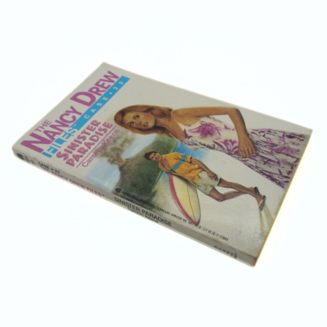 Book cover of 'The Nancy Drew Files' featuring a beach scene with two characters.