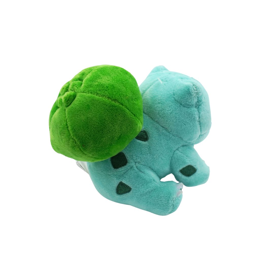 Plush toy with green shell and blue body on a white background