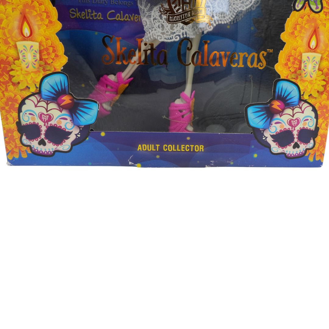 Box of Skelita Calaveras product with colorful skull design and candles on a white background