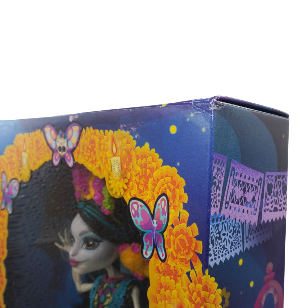 Close-up of a doll with colorful hair and flowers in a decorative box