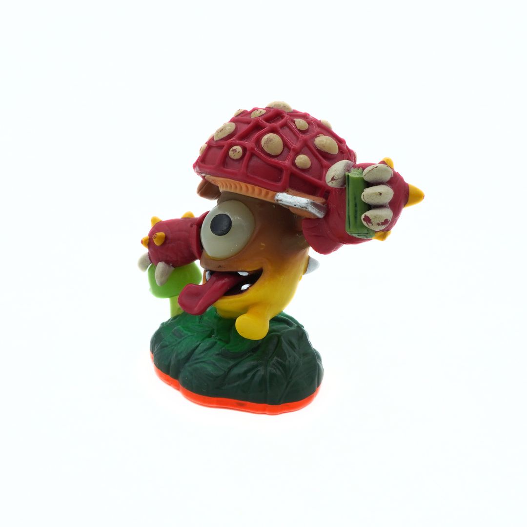 Colorful figurine of a character with a red shell on a white background