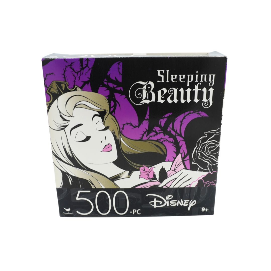 Disney Sleeping Beauty 500-piece jigsaw puzzle box featuring an illustration of Sleeping Beauty with purple trees and roses on a black background.