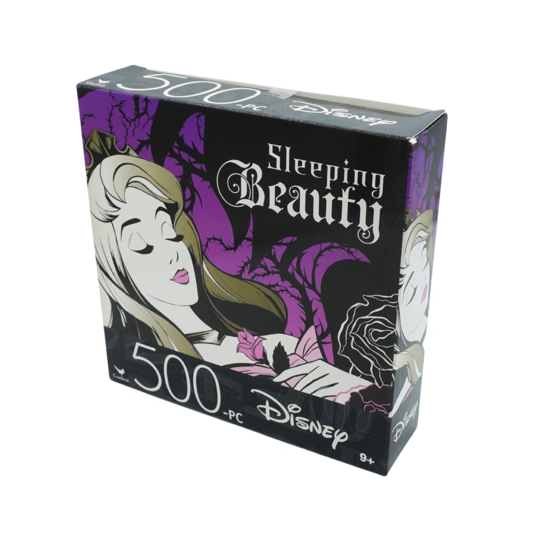 Disney 'Sleeping Beauty' 500-piece jigsaw puzzle box, featuring the classic illustration of Sleeping Beauty on a black and purple background.