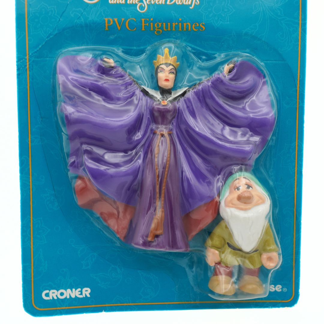 PVC figurines of a witch and a dwarf on a blue packaging with 'Croner' branding.