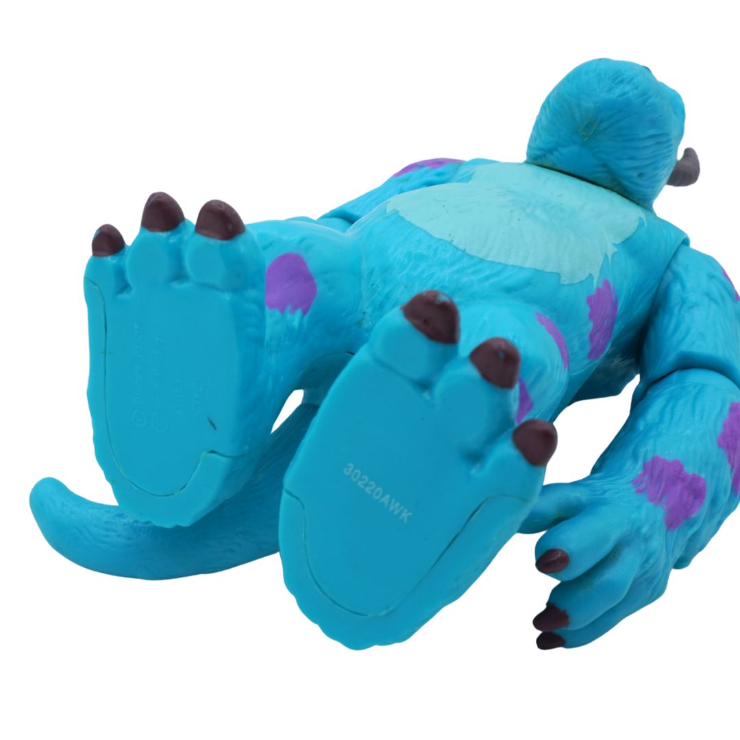 Blue cartoonish creature with purple spots on a white background