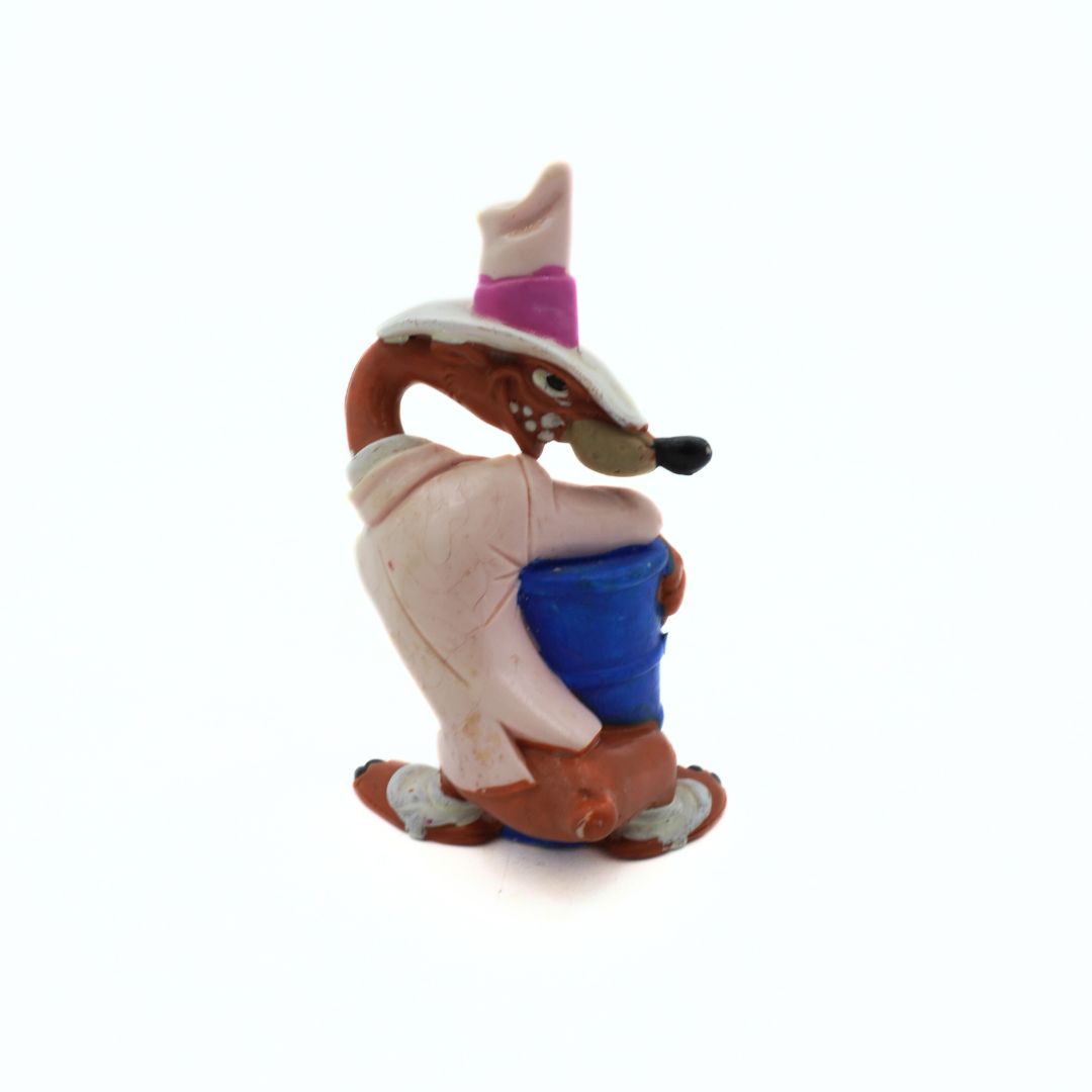 Toy figure of a character with a hat and coat on a white background