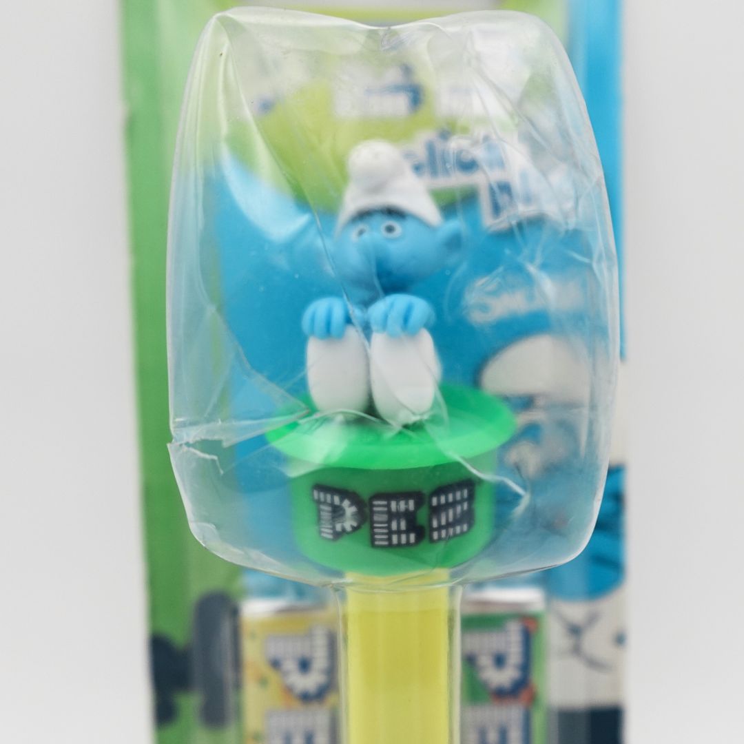 Cracking and damage to the packaging on a Pez Click N Play Smurf Pez Dispenser