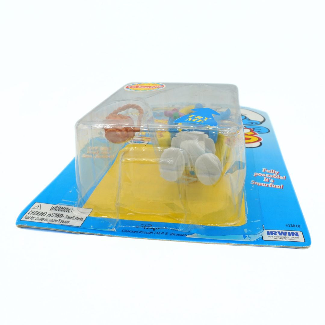 Plastic toy in packaging with visible brand name on a white background
