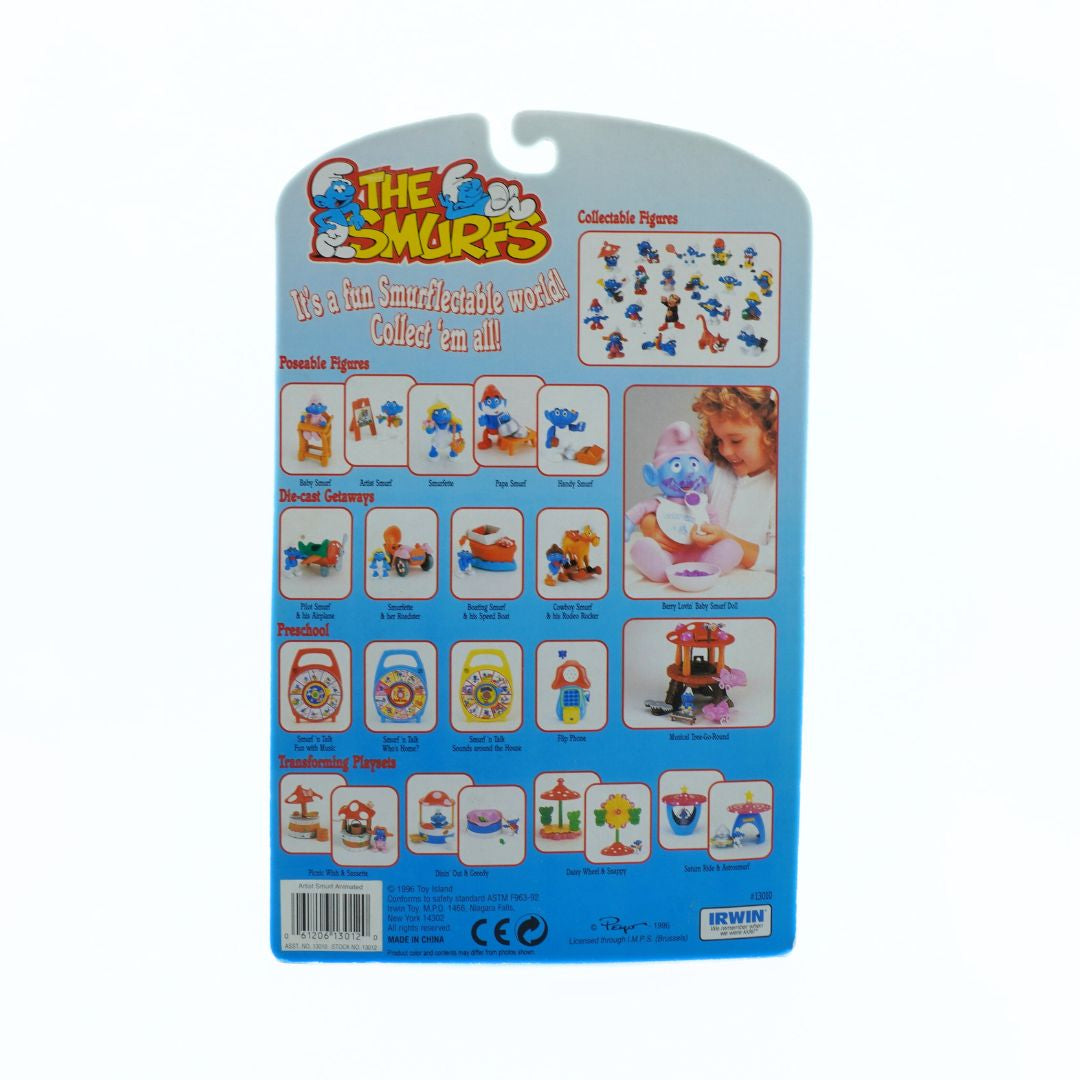Smurfs toy packaging with illustrations of Smurfs and text on a blue background