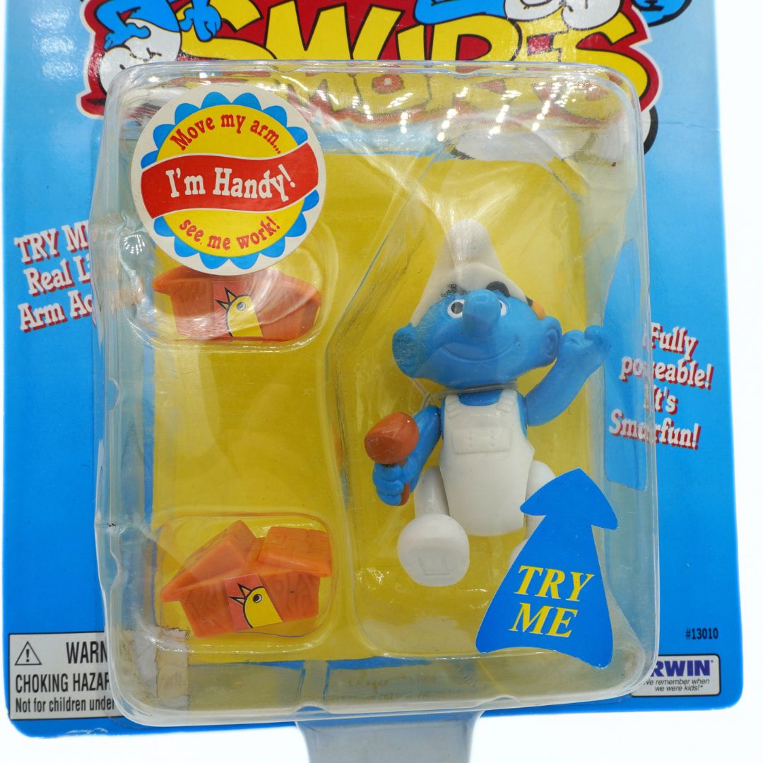 Toy figure in packaging with promotional text on a blue background
