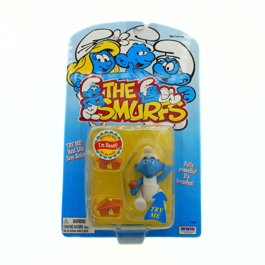 Action figure packaging for 'The Smurfs' with character illustration on blue background