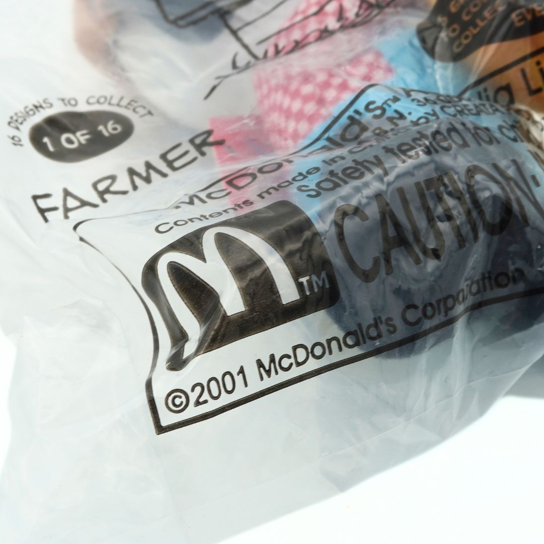 Close-up of a McDonald's toy packaging with branding and text.