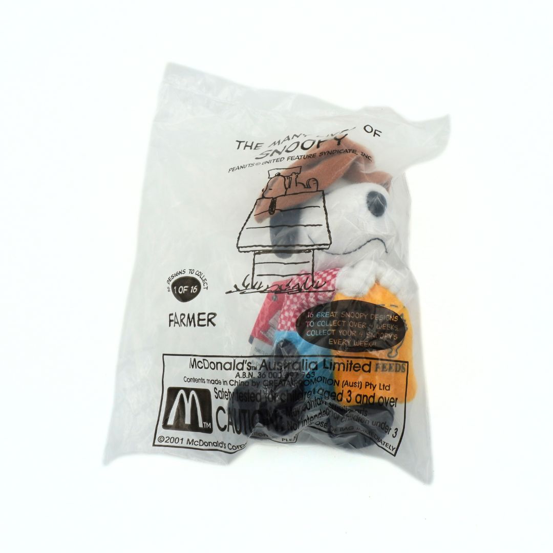 Plush toy of a character from McDonald's Happy Meal in packaging on a white background
