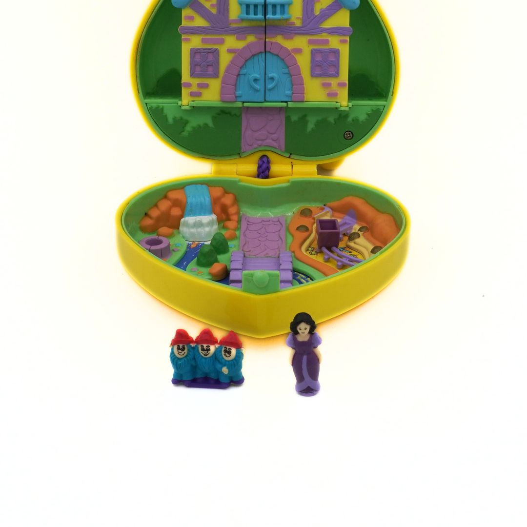 Toy castle set with two figures on a white background
