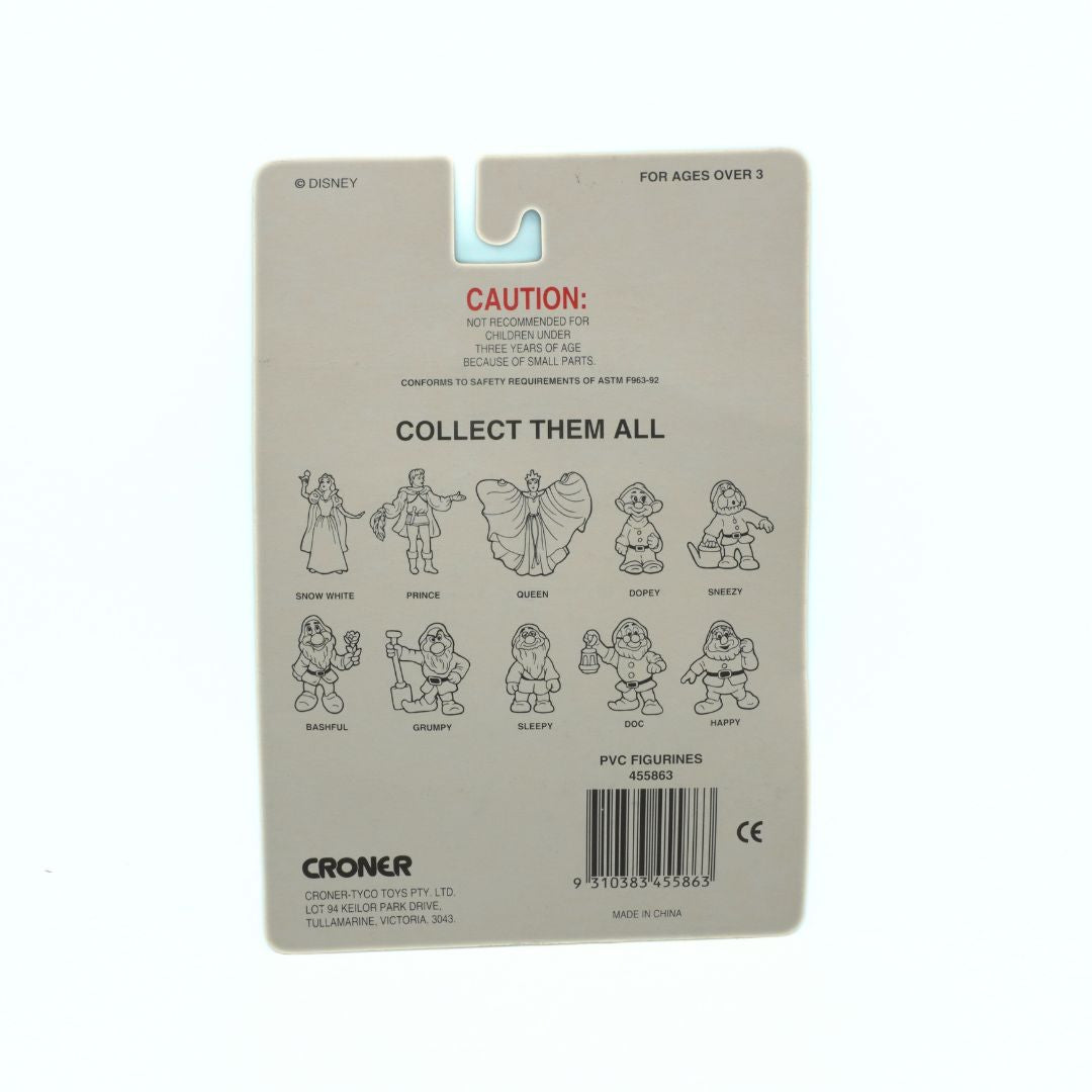 Back of a toy packaging with character illustrations and branding on a beige background