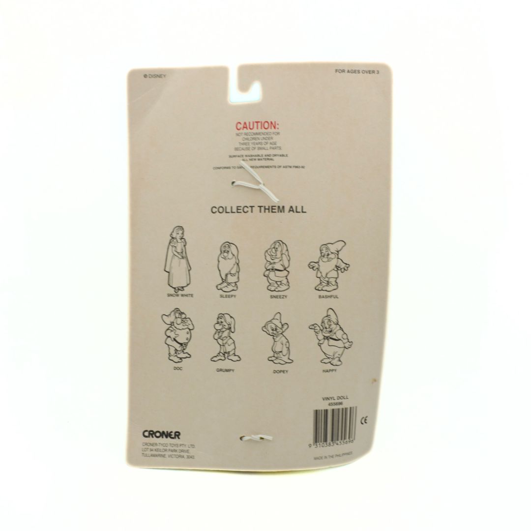 Back of a packaging with cartoon character illustrations and text on a beige background