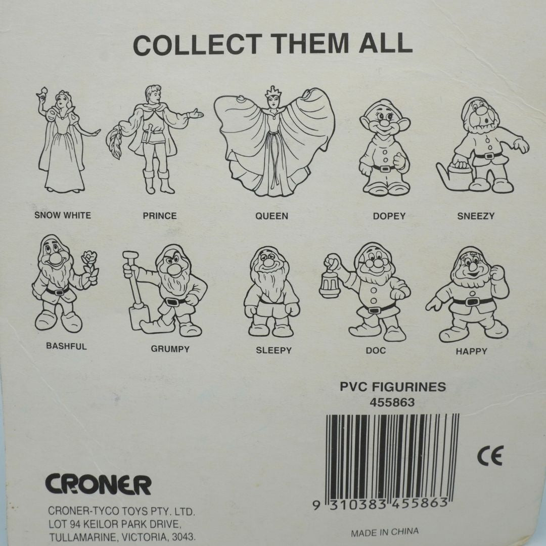 Back of a product packaging with illustrations of Snow White and the Seven Dwarfs, and text 'Collect Them All'.