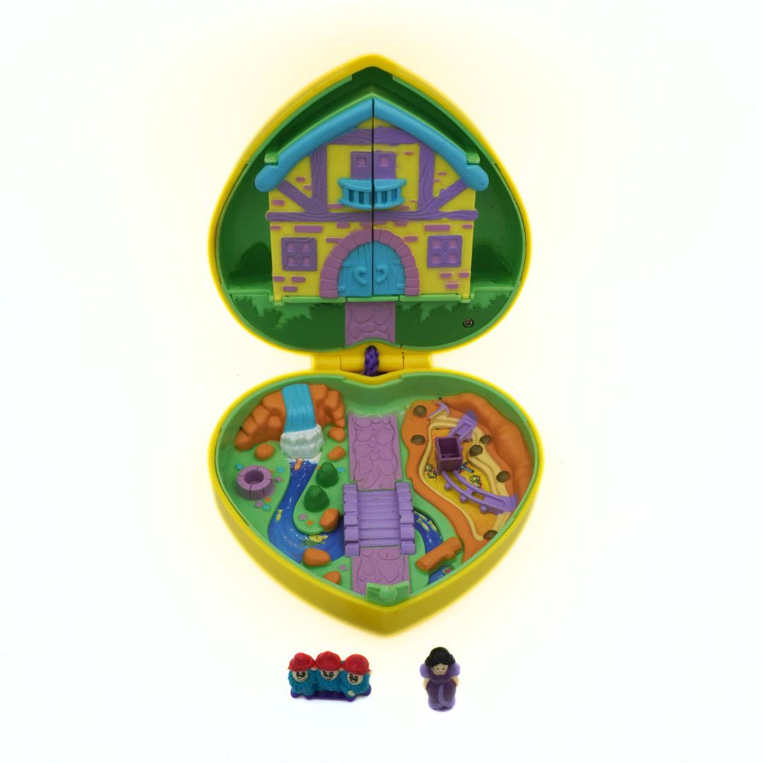 Toy set with a colorful castle-like structure and small figures on a white background