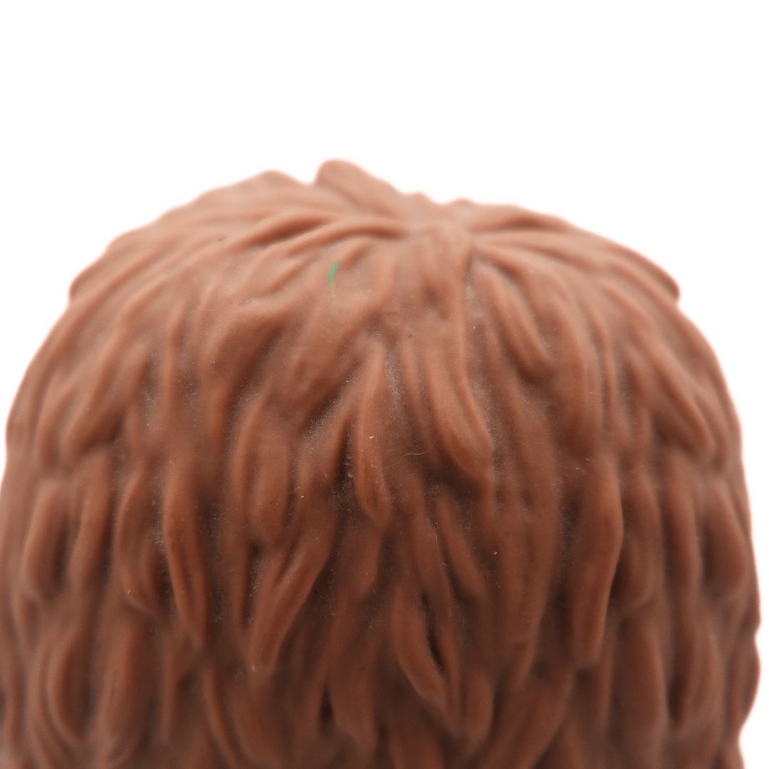 Close up of the Snuffleupagus Funko Pop's head showing a green mark