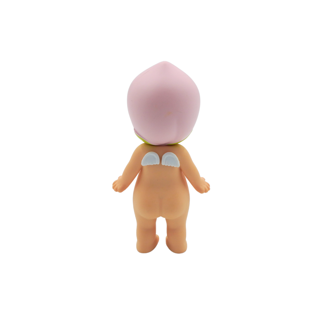 A peach themed Sonny Angel with a light pink peach hat, photographed on a white background.