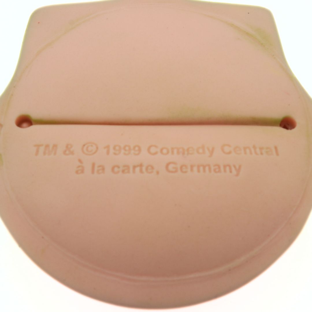 Closeup of the copyright and branding information embossed on a 1999 South Park Kyle coin purse