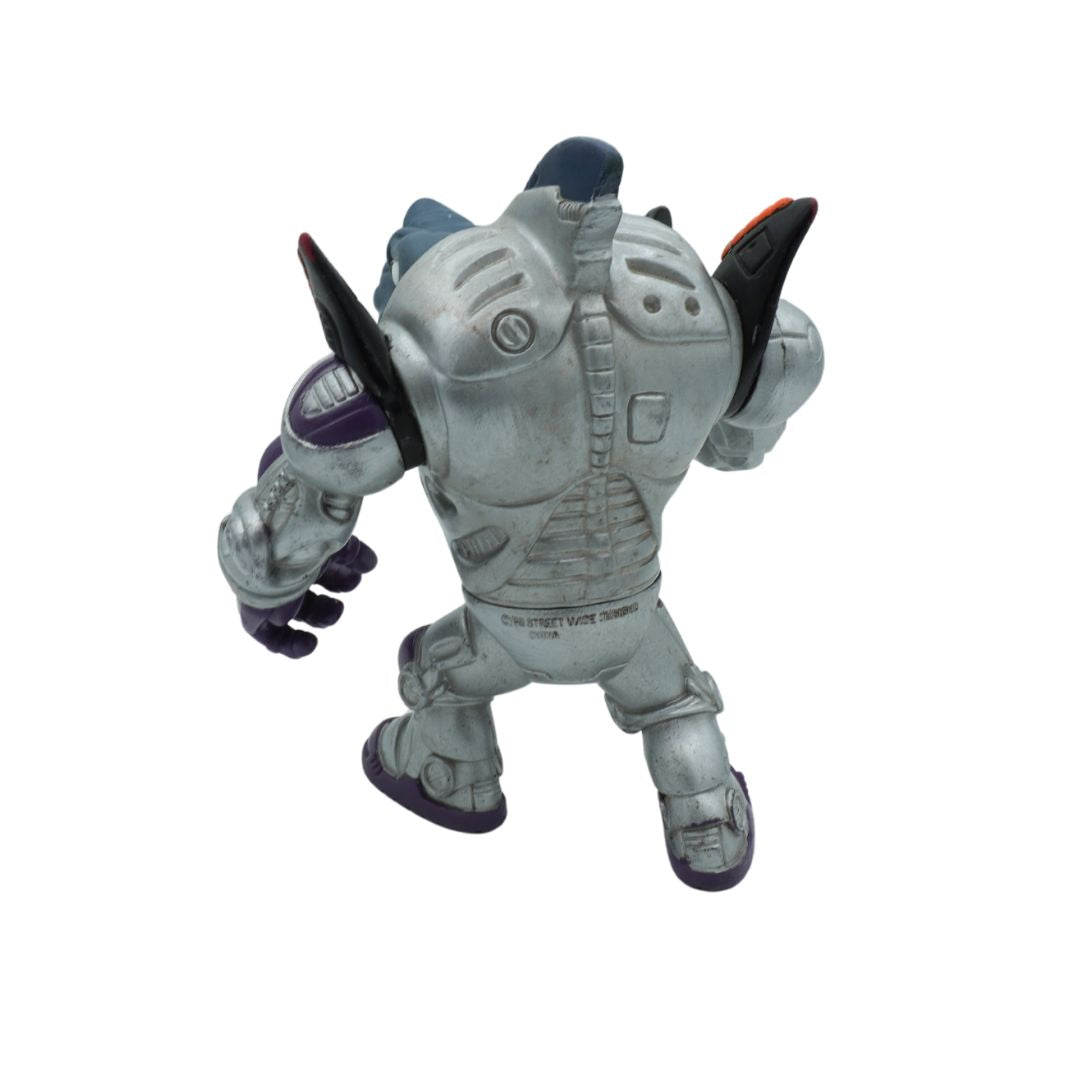 Toy figure in gray armor with a weapon on a white background