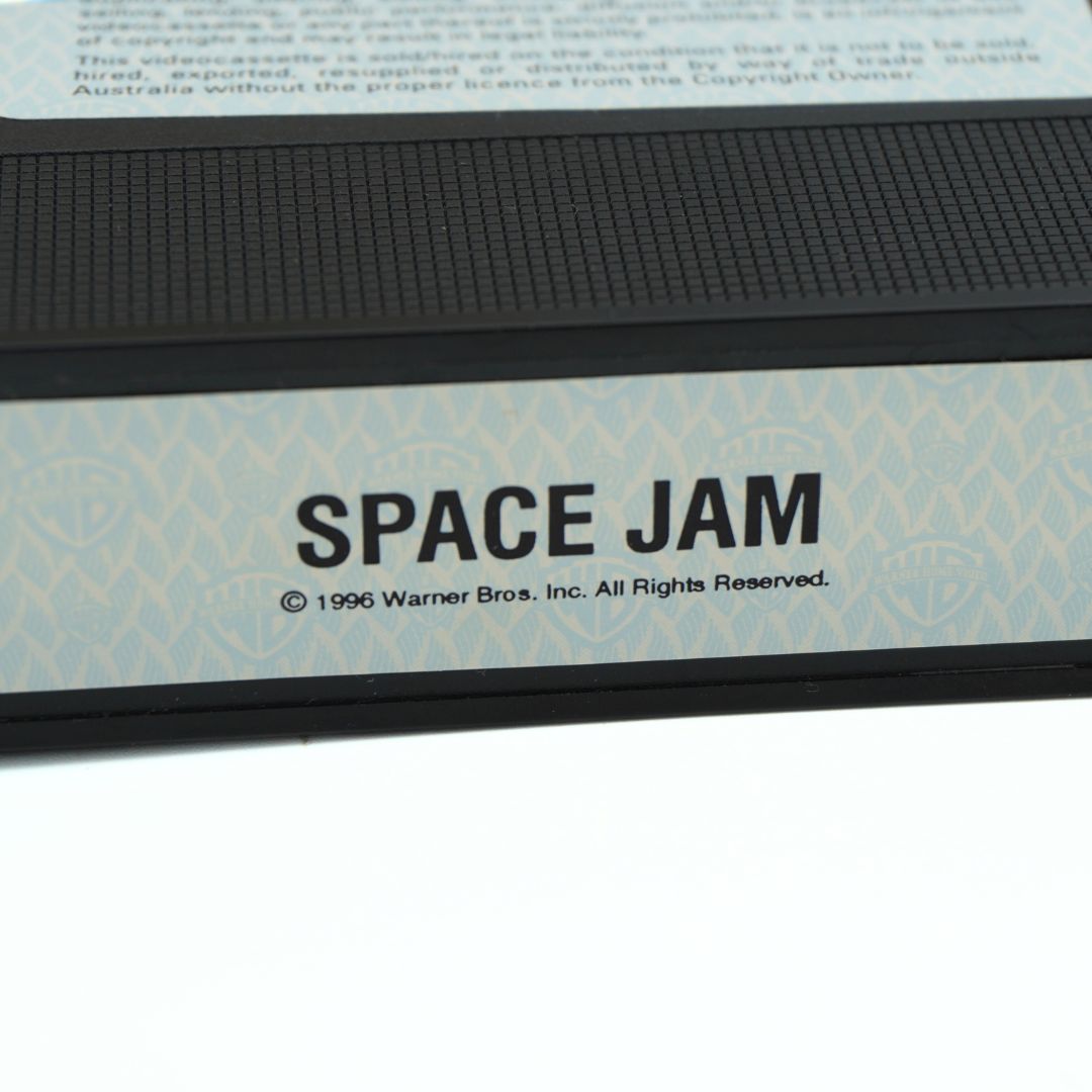 Sticker on the 1997 Space Jam VHS cassette featuring Warner Bros. copyright information