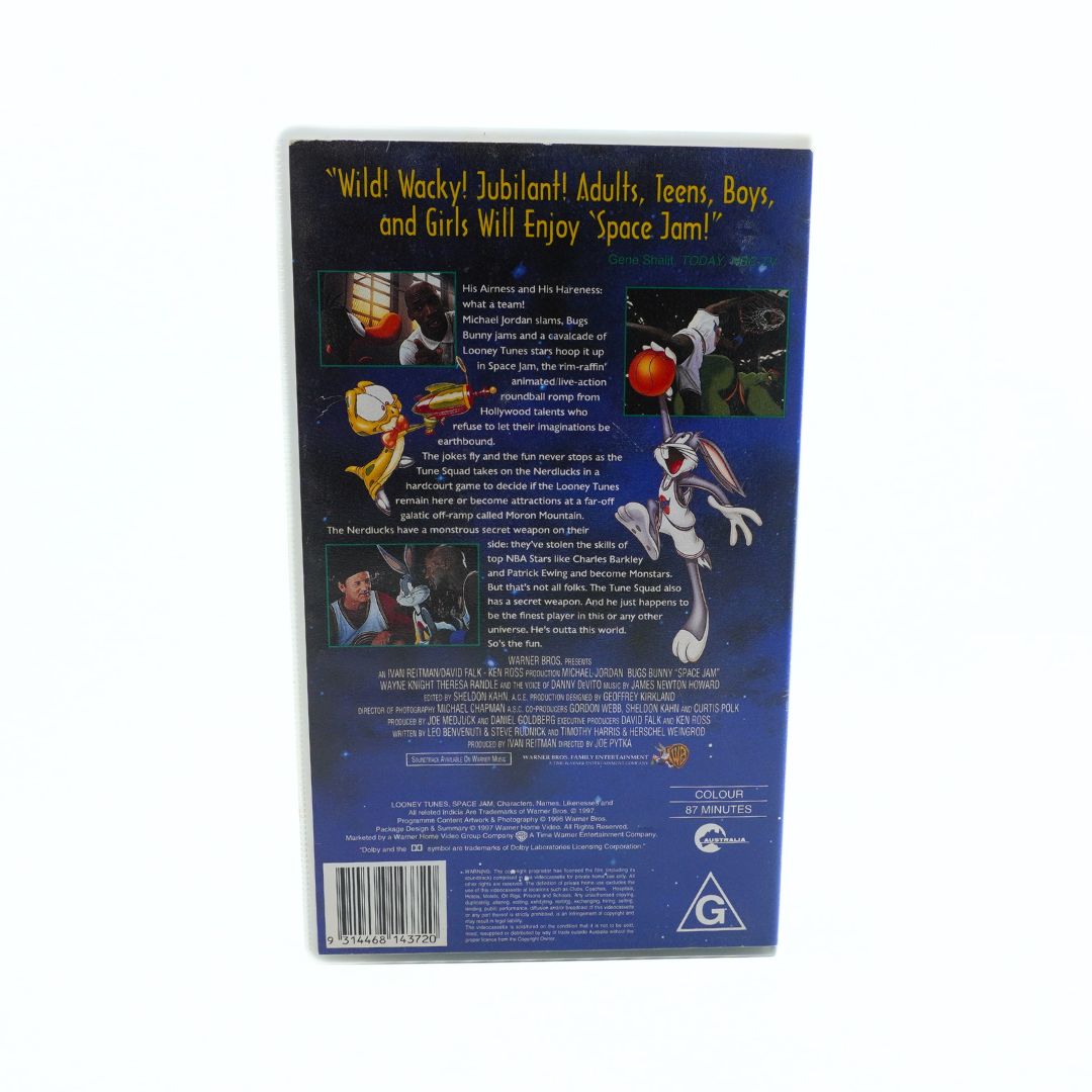 Back cover of the Space Jam VHS clamshell case featuring the G rating, plot description and screen grabs from the film