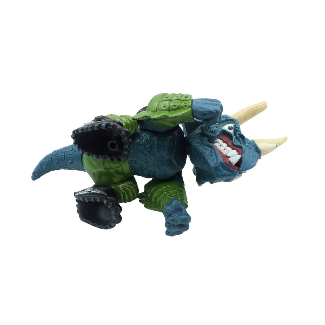 Toy figure of a blue and green creature with a white background