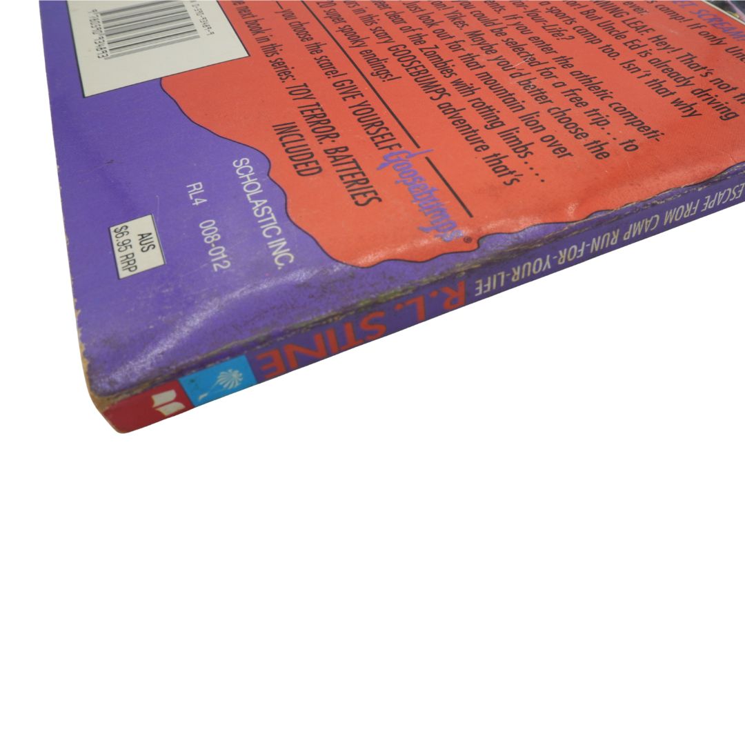 Close-up of a book with visible text and branding on a white background