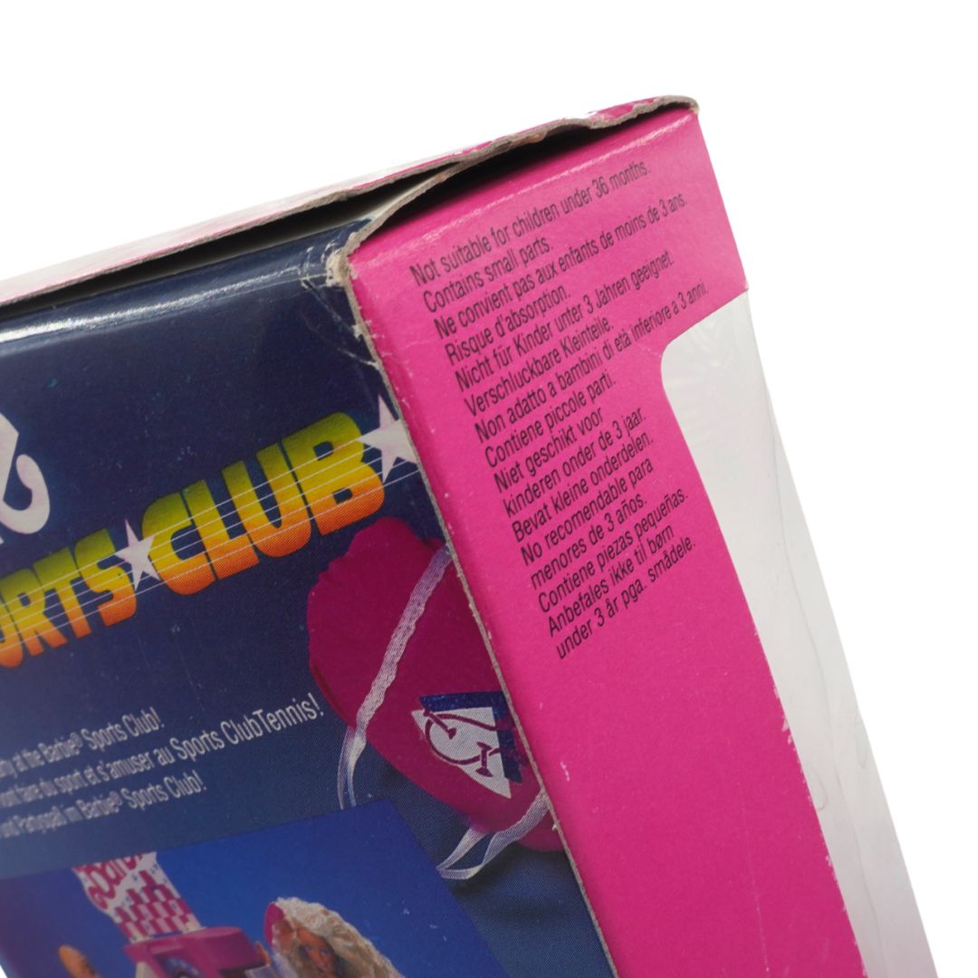Close-up of a toy box with 'Sports Club' branding on a white background