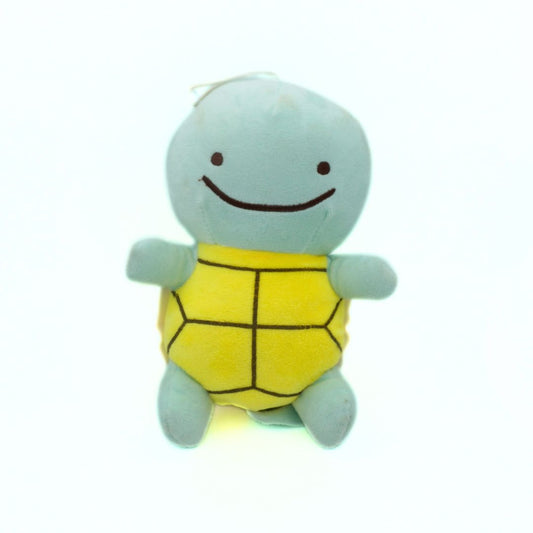 Plush toy turtle with a yellow shell on a white background