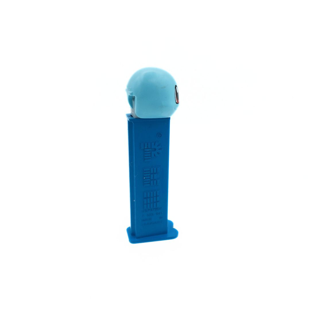 Side on photo of a Squirtle Pez dispenser with a light blue head and darker blue body