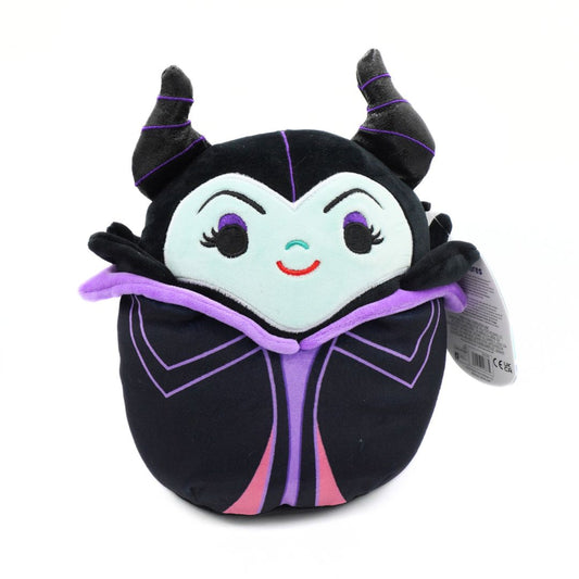 A plush toy of the Disney Maleficent character, styled like a Squishmallows figure, featuring a black body, purple horns and trim, a pale blue face, and embroidered facial features on a white background.